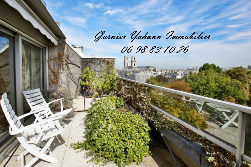 Propriété de Prestige au Cœur d'un Immeuble Parisien Emblématique